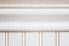 beadboard wainscoting with trim under a stucco wall