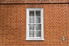 Brick exterior with a sash window