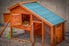 wooden chicken coop with a blue roof