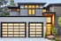 a house with screen-door style garage doors