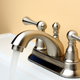 brushed nickel faucet on white sink