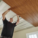 Man installing plank ceiling