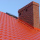 a red roof with brick chimney