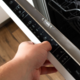 hand opening dishwasher door