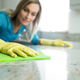 woman wiping down a countertop