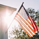 American flag hanging on house porch