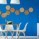 clean dining space with bright blue wall and geometric shapes