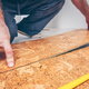 a man installing cork flooring