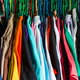 A closet stuffed with colorful clothes