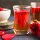 rose petals in water with mortar and pestle on table