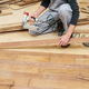 A man installs flooring.