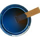 A paint can of medium blue paint with a wood stir stick inside.