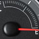 A fuel gauge for a car showing the tank on empty. 