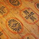 A wood floor stenciled with red and blue paint. 
