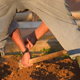 Turning clay soil by hand.