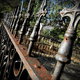 Old, weathered, ornate metal fencing