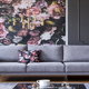 light grey couch against dark grey wall