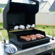 grilling meat on a natural-gas barbecue in the backyard