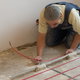 person working on subflooring