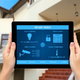 A smart house app open on a tablet.