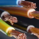 close up of different colored wires with their copper interiors showing