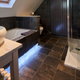 bathroom with polished stone tile floor