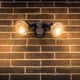 Flood lights mounted to a brick wall