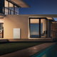 A modern house with the Tesla Powerwall Home Battery. 