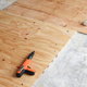 concrete basement floor with plywood subfloor materials