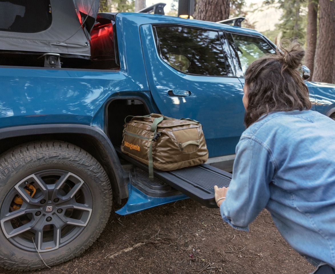 Hidden compartment in the side of the Rivian R1T easily stores a large hiking backpack.