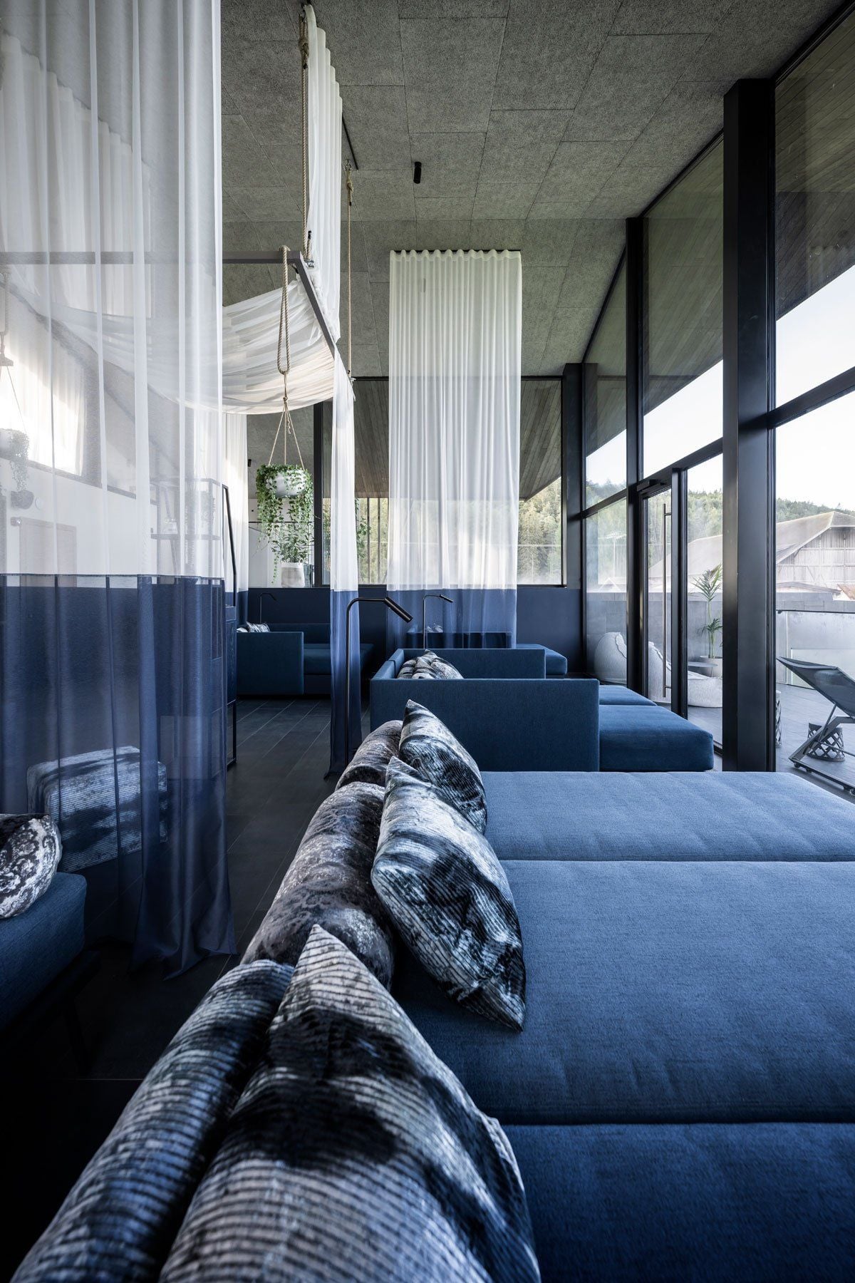 Lush blue wellness area inside the noa-designed AEON Hotel in Tyrol, Italy.