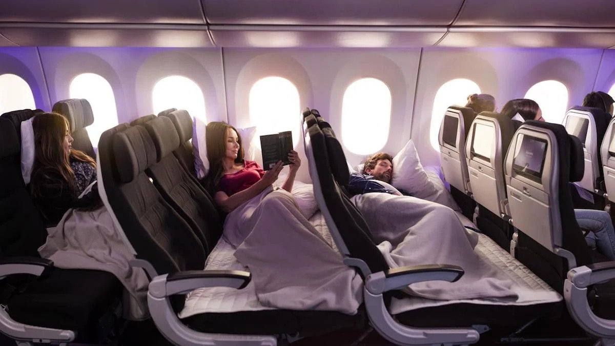 Economy class passengers rest on a pair of Air New Zealand 