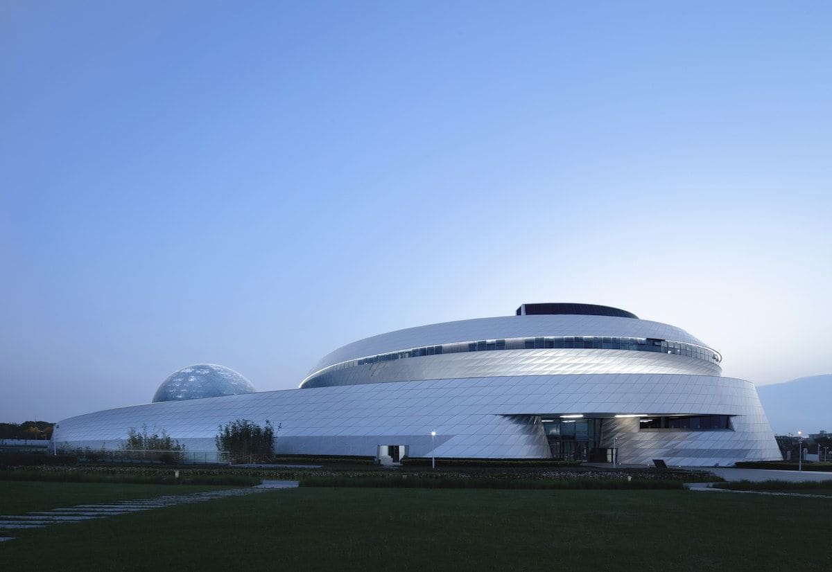 The Ennead Architects-designed Shanghai Astronomy museum emits an otherworldly glow at dusk. 