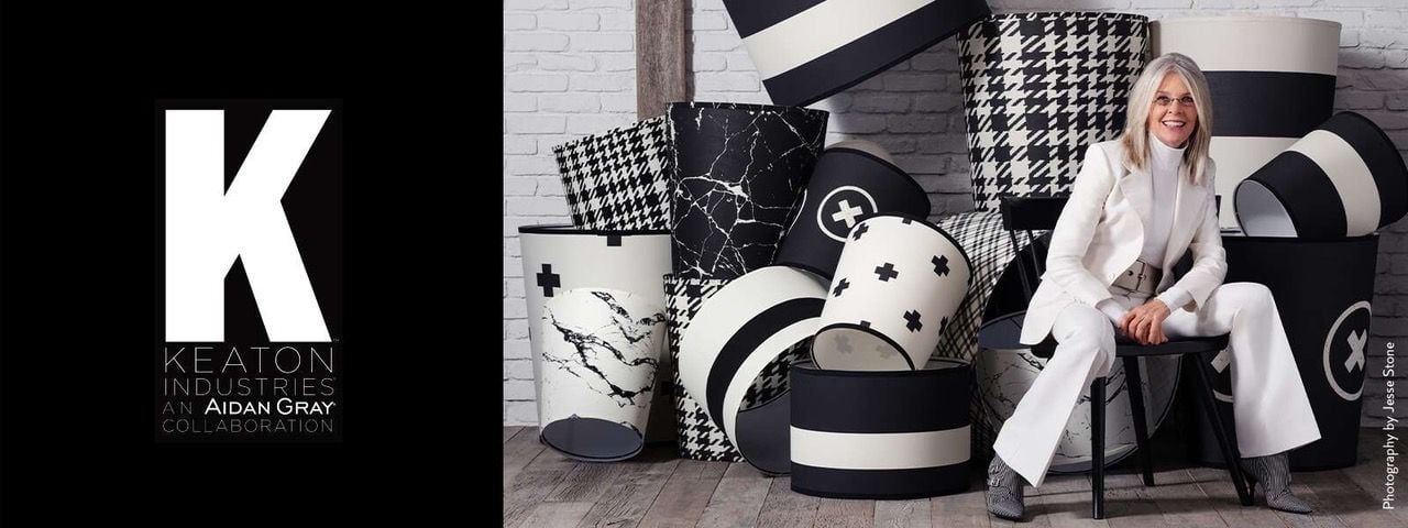 Diane Keaton sits in front of several lampshades she helped design with Perigold.