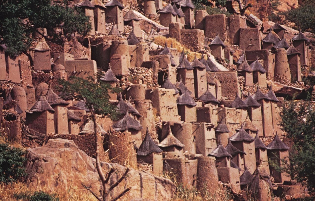  Dogon mud houses tucked into the Bandiagara Escarpment in Mali.