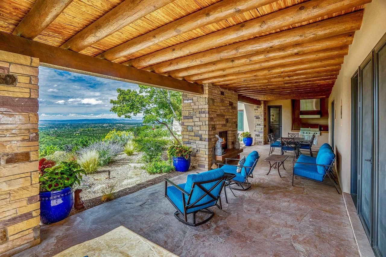 Sapcious outdoor terrace at 1432 Old Sunset Trail looks out onto the surrounding New Mexico nature. 