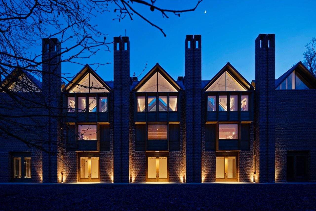 Nighttime view of the Níall McLaughlin-designed New Library at Magdalene College in Cambridge, UK.