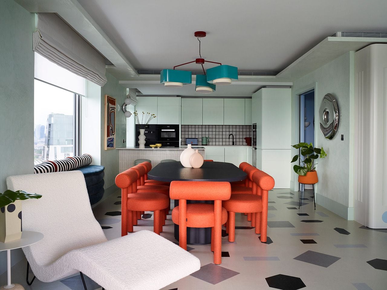 Chic, contemporary kitchen space inside Owl Interior Design's Bowie-inspired London apartment. 