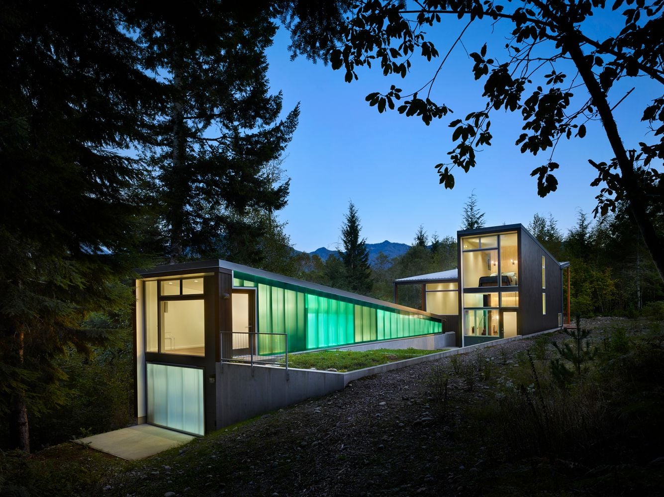 Bear Run Cabin emits a ghostly green glow in the evening darkness. 