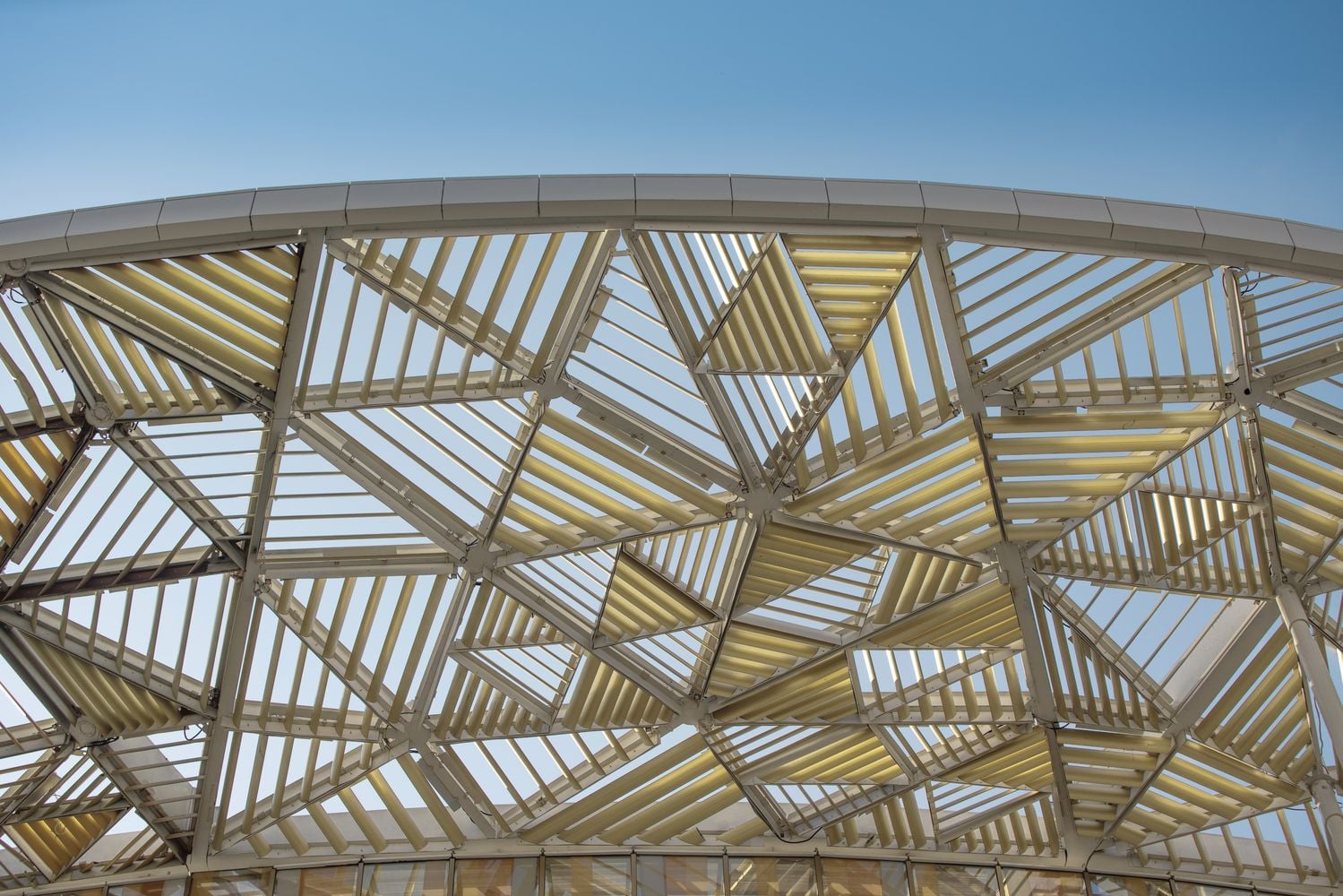 Golden slats adorn the top of the Wuxi Taihu's white columns to create a mock canopy. 