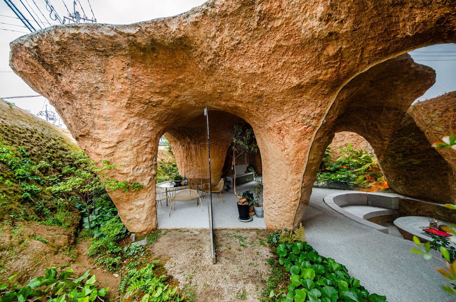 Semi-covered patio space in the Junya Ishigami-designed House and Restaurant Cave.