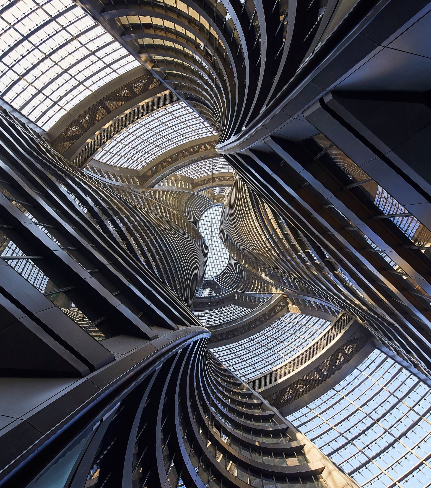 Upward view of the Leeza SOHO Tower's spiraling central atrium 