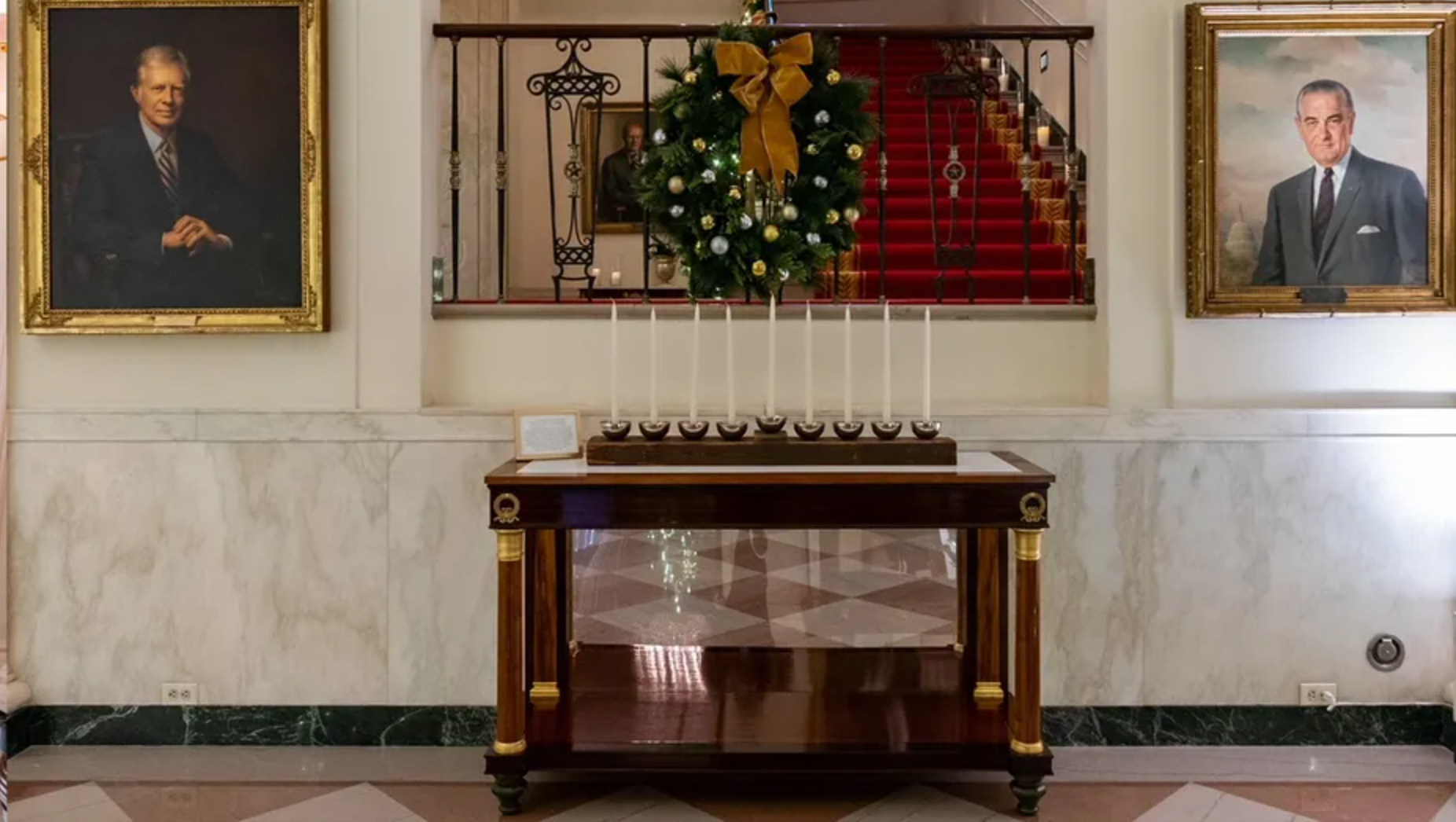 Menorah created by the Executive Residence Carpentry Shop from wood removed from the White House in the 1950s, as featured in the 2022 White House Holiday Decor.  