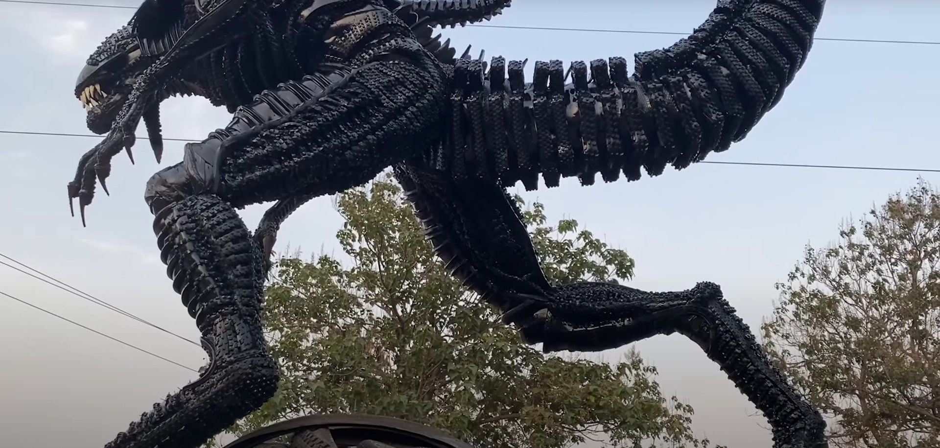 Back view of the Tireman's Alien King sculpture, made using recycled bicycle tires and inner tubes.