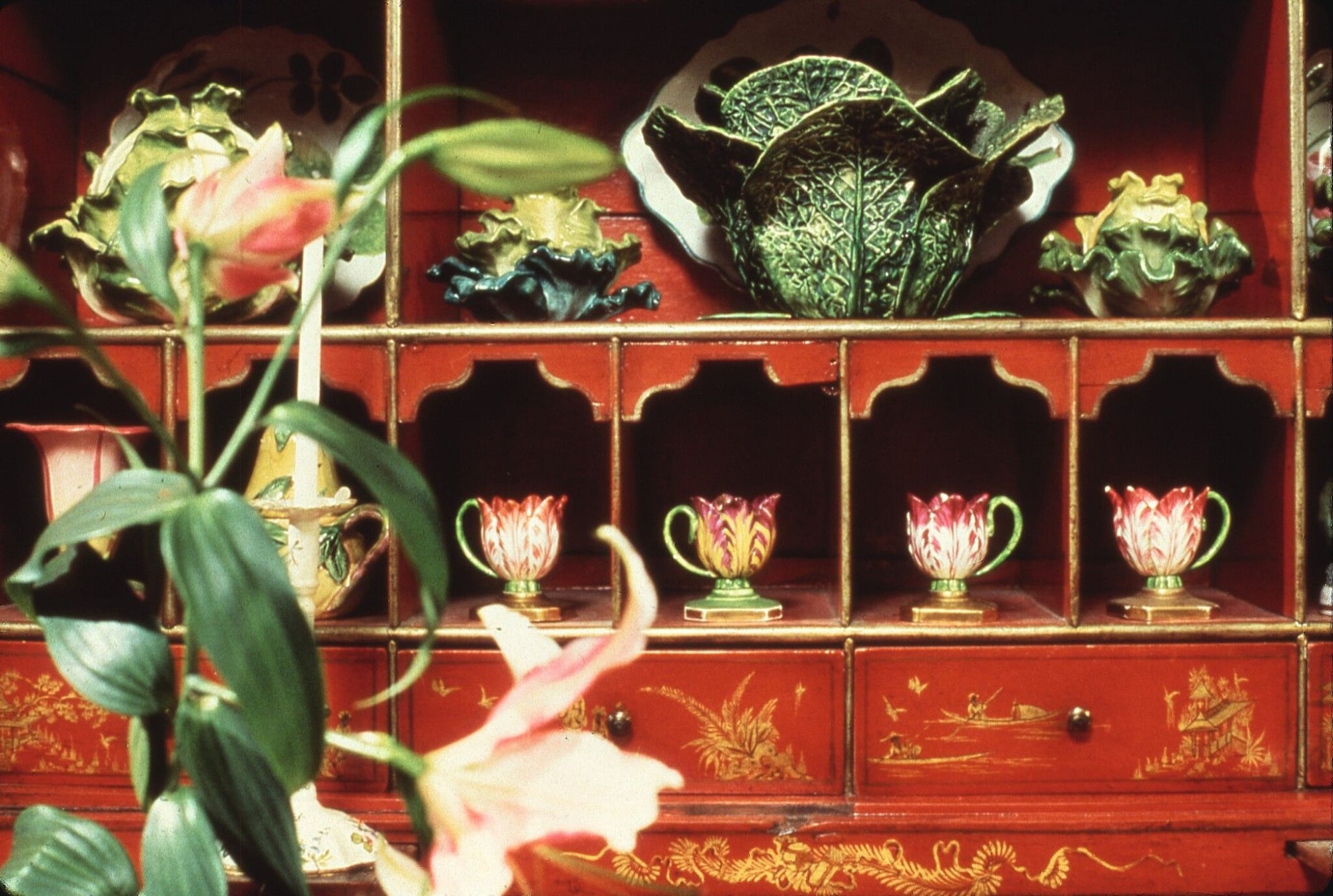 Majolica pottery used to adorn a similarly maximalist dresser.