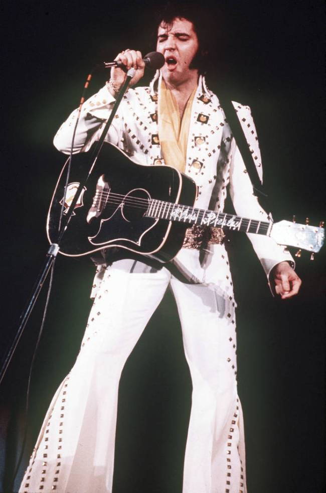 Iconic rock and roll singer Elvis Presley during one of his performances.