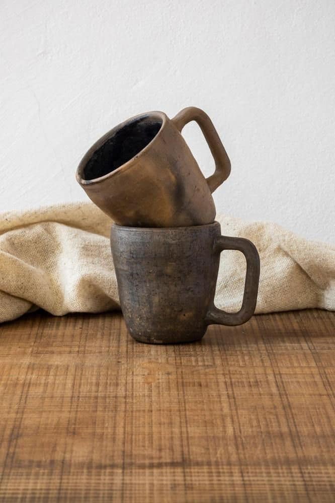 Neutral colored handmade mugs from Wool + Clay.