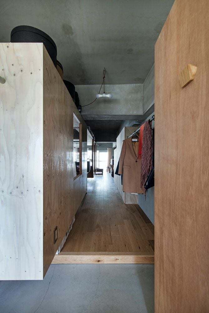 Narrow hallway/closet area rests in between plywood boxes inside YAP's new renovated Kyoto condo.