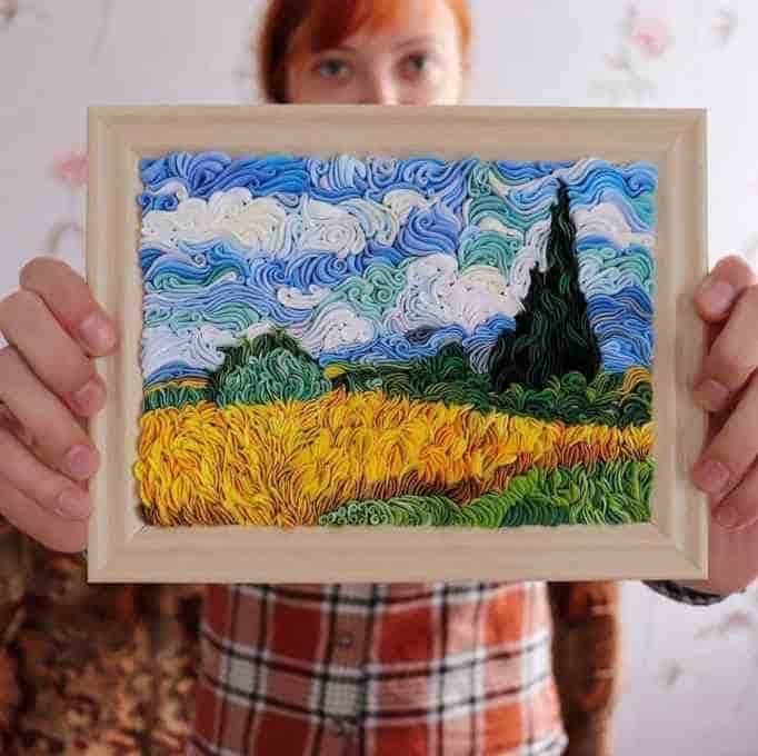 Alisa Lariushkina holds up a small air-dry clay re-creation of Van Gogh's 
