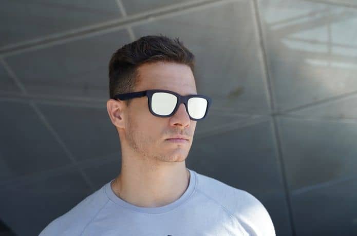 A pair of Dusk smart sunglasses with mirrored lenses.